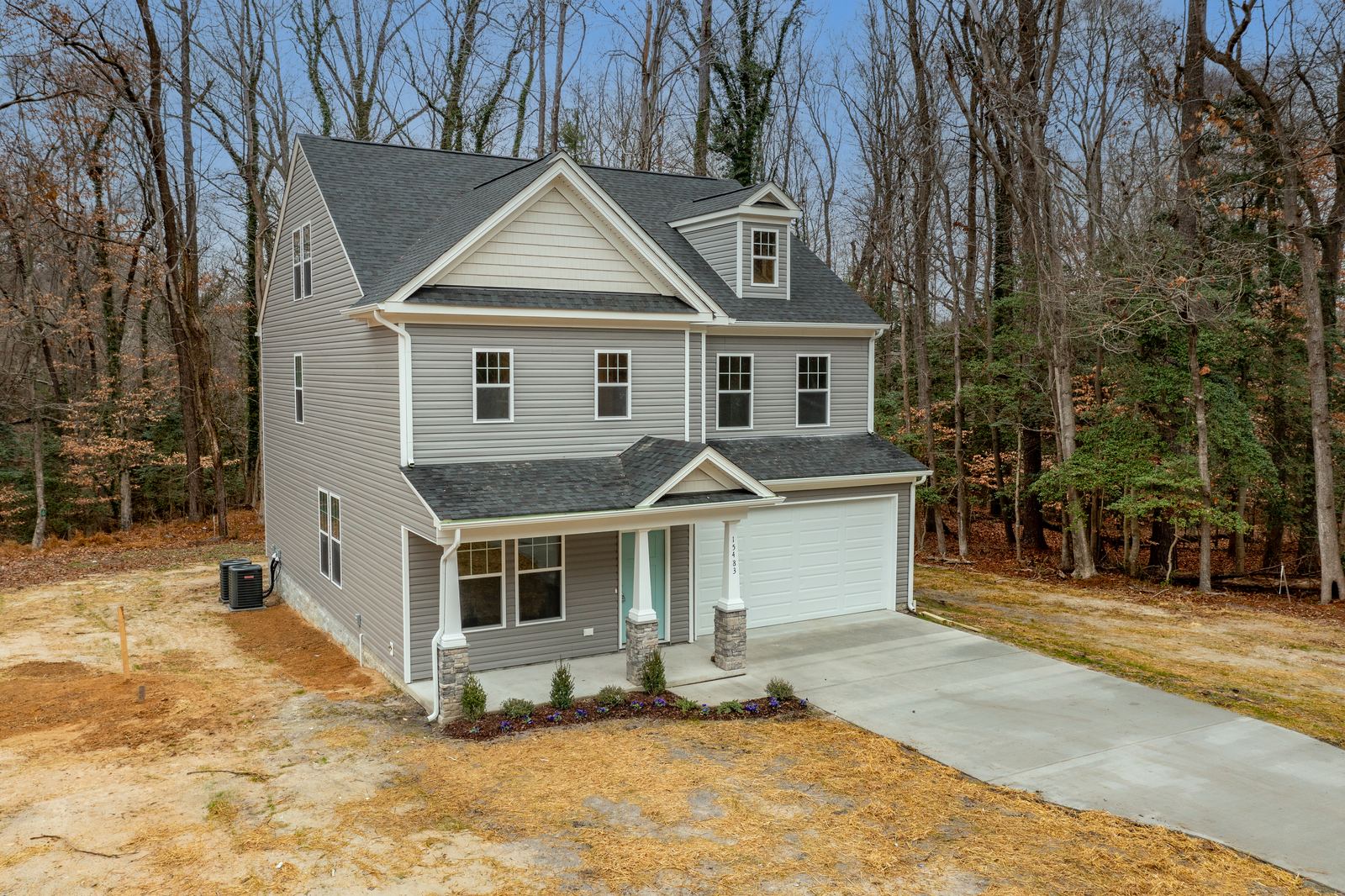 Front of a finished Kenston II home from the three-story album